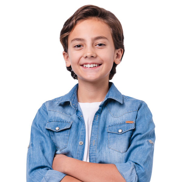 young boy smiling with arms crossed
