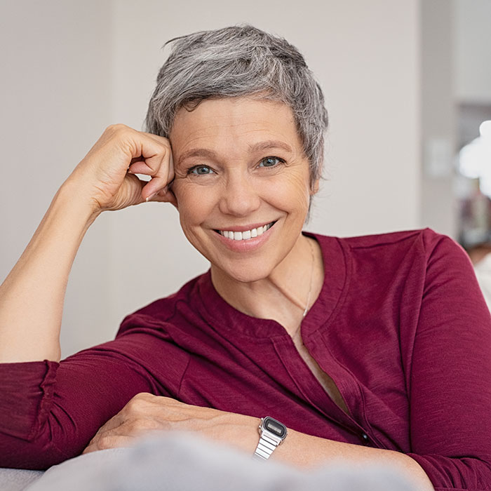 mature woman smiling indoors